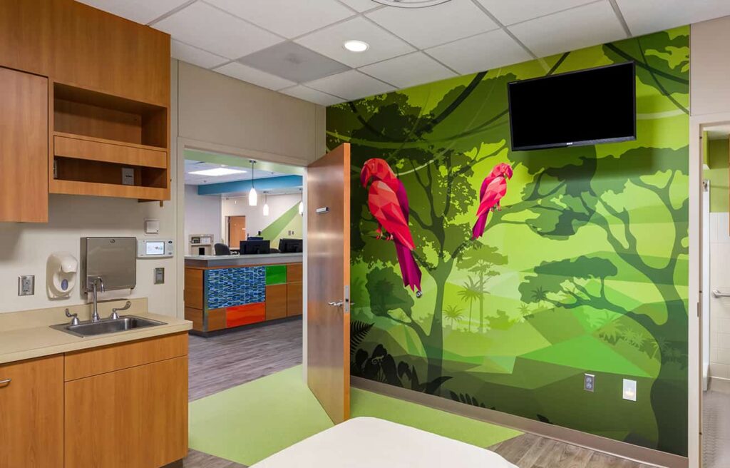 Footwall and view to the nurses station from a patient room featuring a parrot wall mural.
